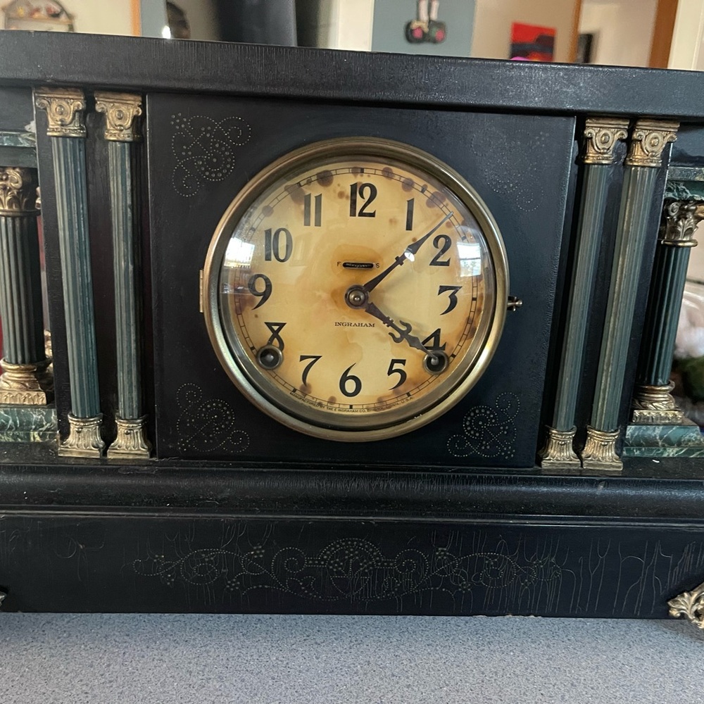 Elegant Black and Gold Mantel Clock